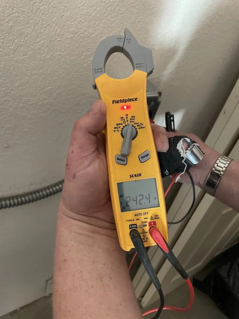 Voltage testing with clamp meter during Electrical Installation Services in Arden-Arcade